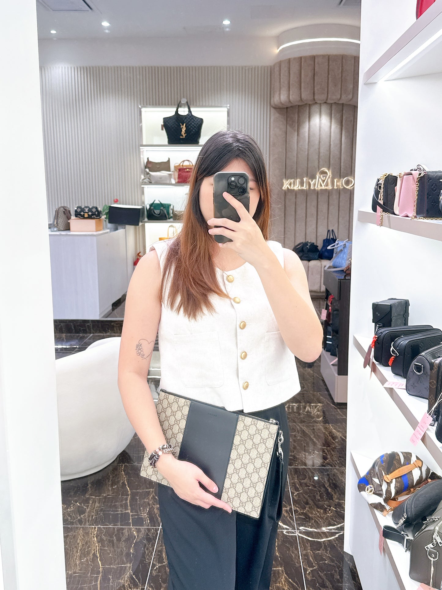 Gucci Supreme Clutch