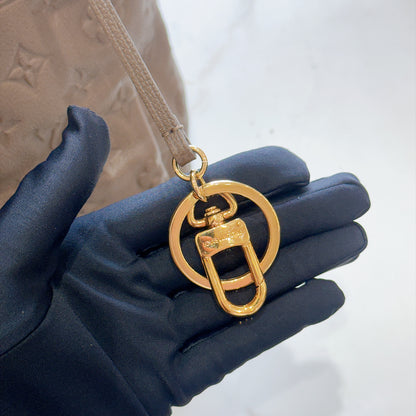 LV Artsy MM Monogram Empreinte Leather in Terre