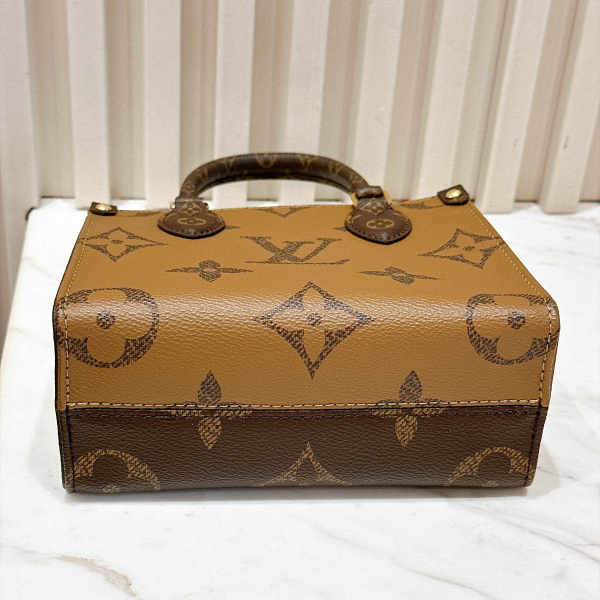 LV On The Go BB in Reverse Monogram