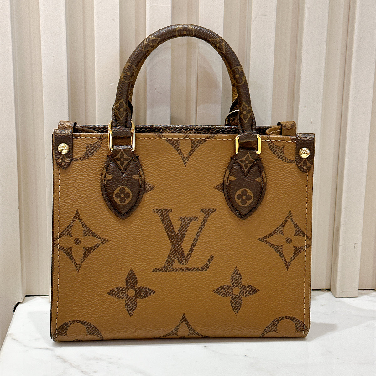 LV On The Go BB in Reverse Monogram