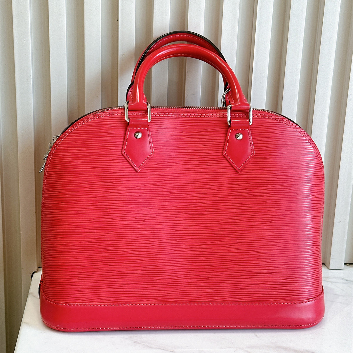 LV Alma PM in Pink Epi Leather