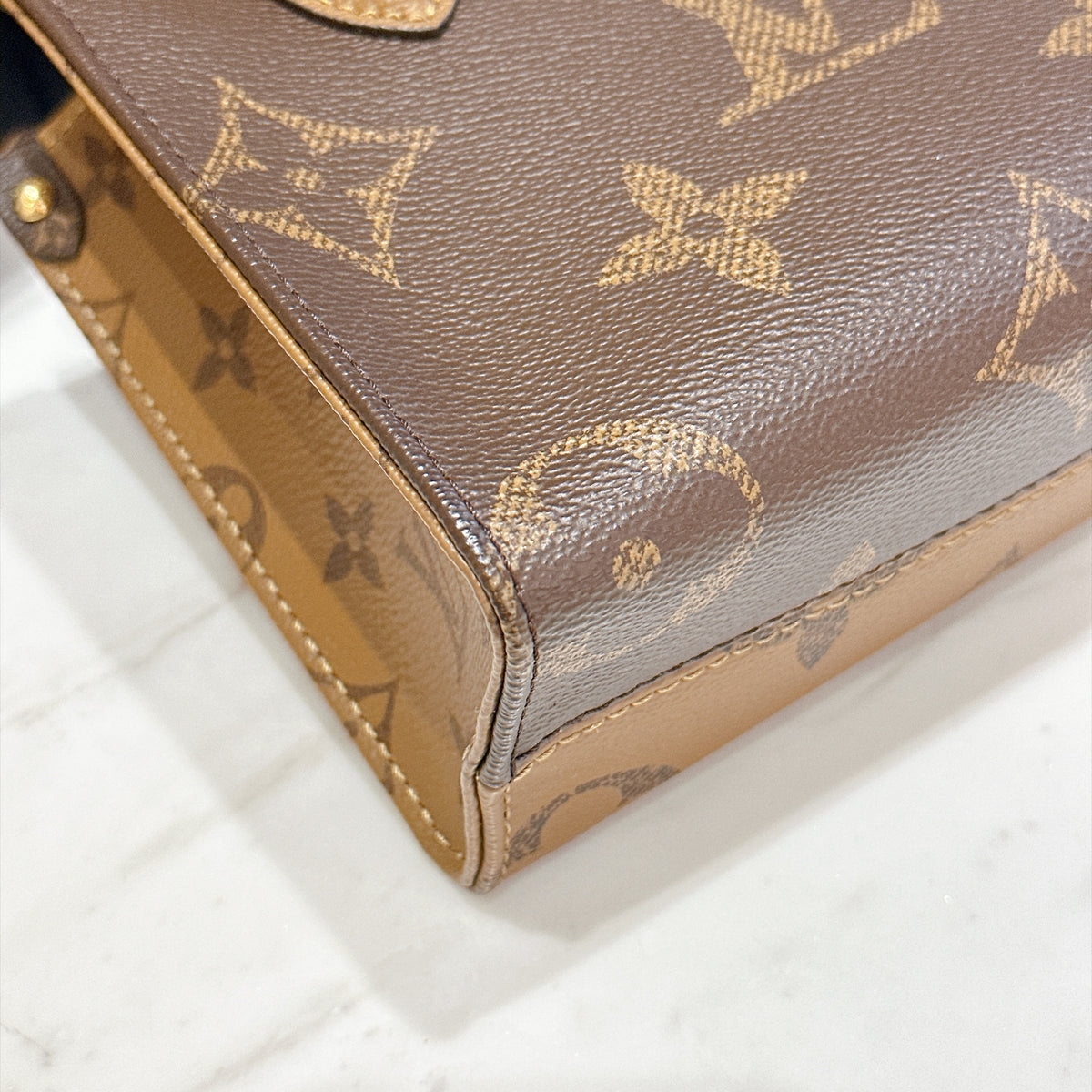 LV On The Go BB in Reverse Monogram