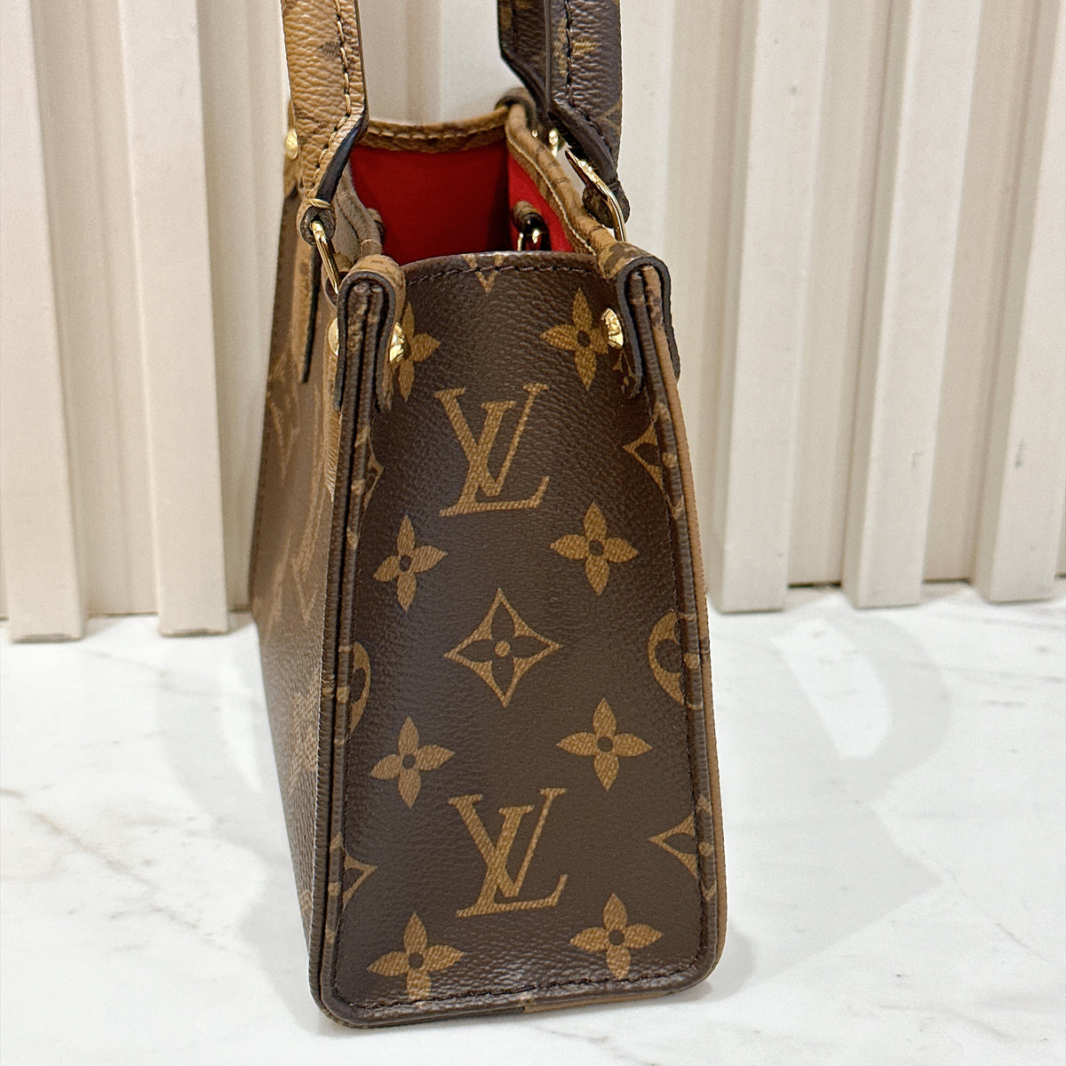 LV On The Go BB in Reverse Monogram