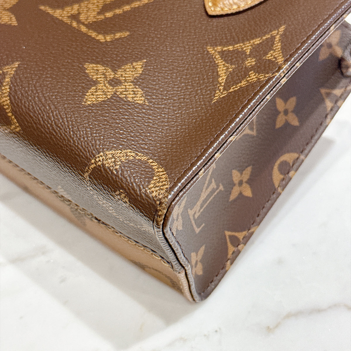 LV On The Go BB in Reverse Monogram