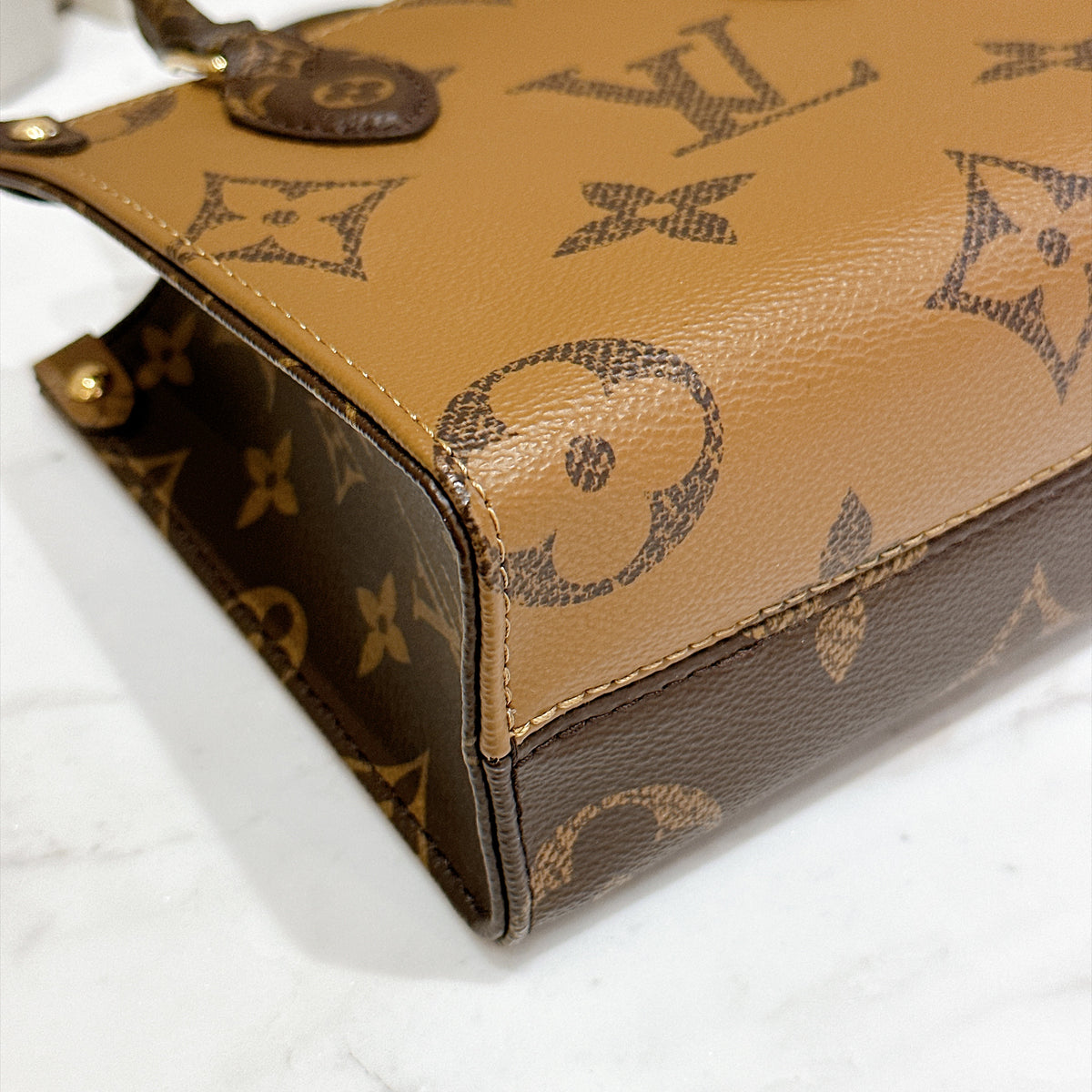 LV On The Go BB in Reverse Monogram