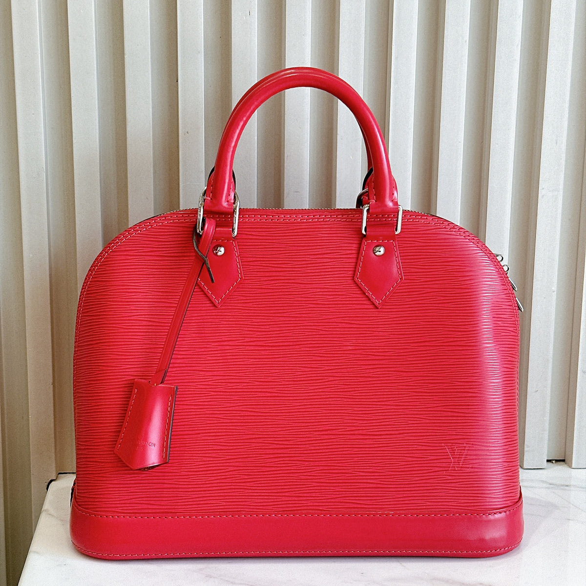 LV Alma PM in Pink Epi Leather