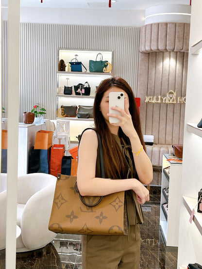 LV On The Go MM in Reverse Monogram