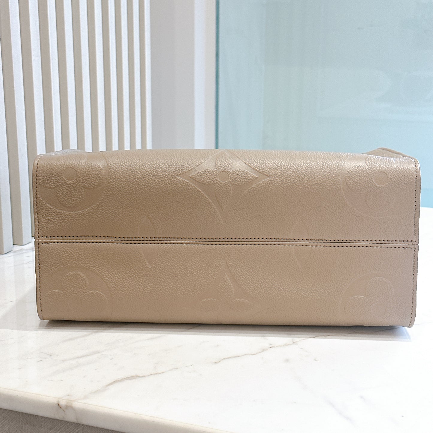 LV On The GO MM in Tourterelle Empreinte Leather