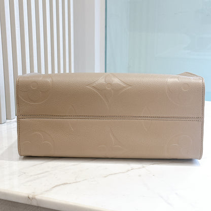 LV On The GO MM in Tourterelle Empreinte Leather