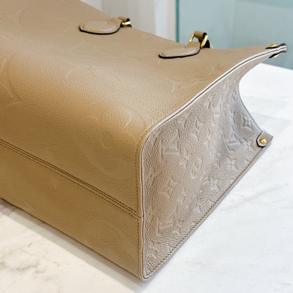 LV On The GO MM in Tourterelle Empreinte Leather