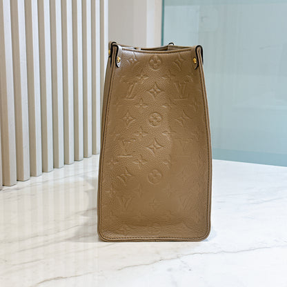 LV On The GO MM in Tourterelle Empreinte Leather
