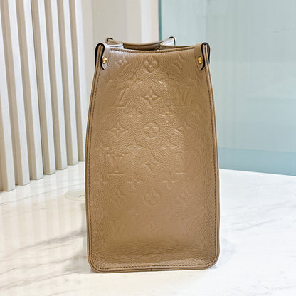 LV On The GO MM in Tourterelle Empreinte Leather