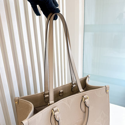 LV On The GO MM in Tourterelle Empreinte Leather