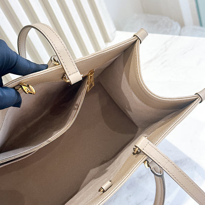 LV On The GO MM in Tourterelle Empreinte Leather