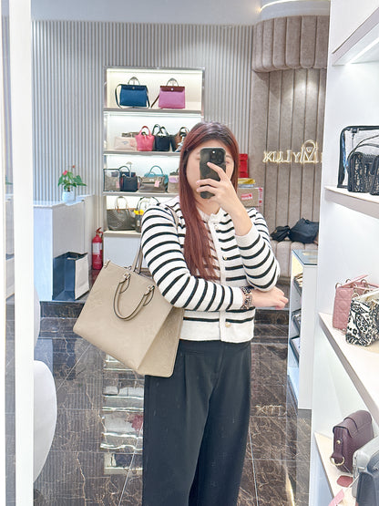 LV On The GO MM in Tourterelle Empreinte Leather