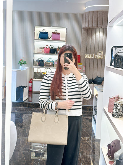 LV On The GO MM in Tourterelle Empreinte Leather