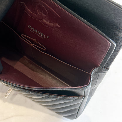 Chanel Classic Flap Medium in Black Chevron Caviar Leather