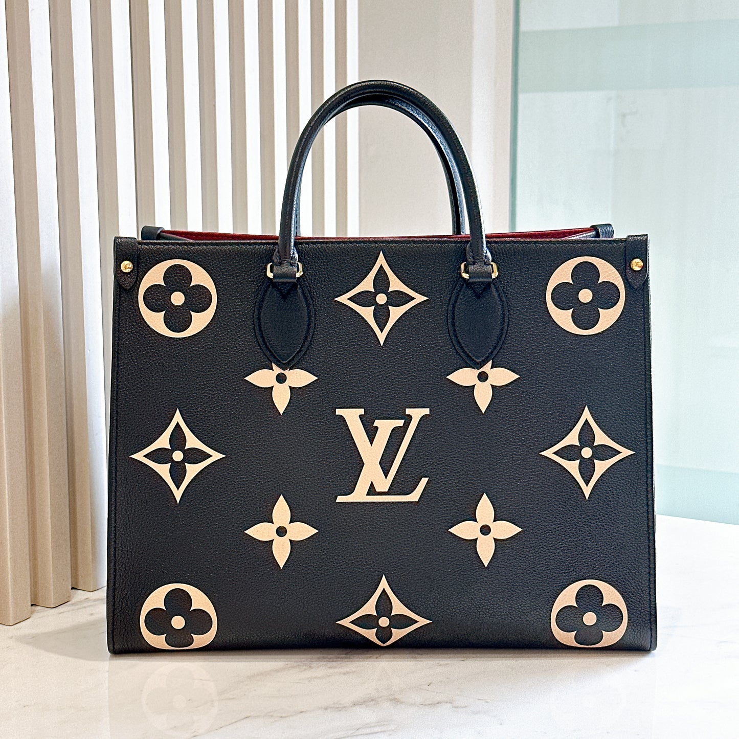 LV On The Go MM in Black and Creme