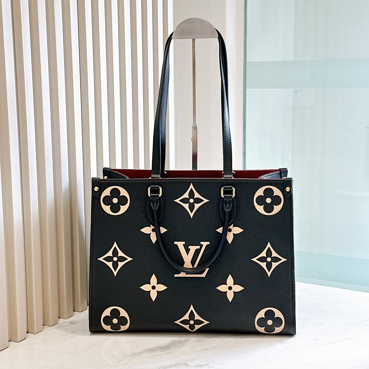 LV On The Go MM in Black and Creme