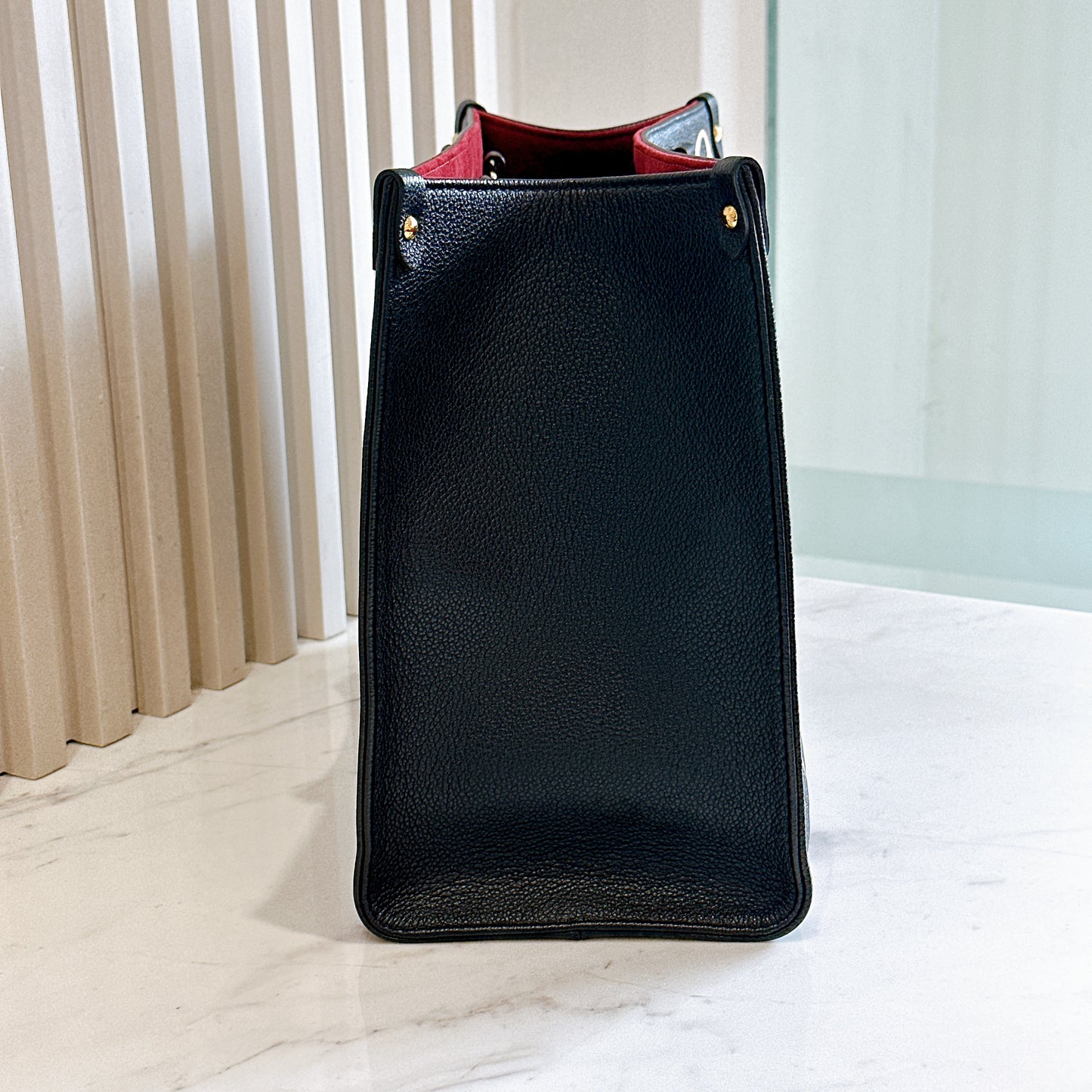 LV On The Go MM in Black and Creme
