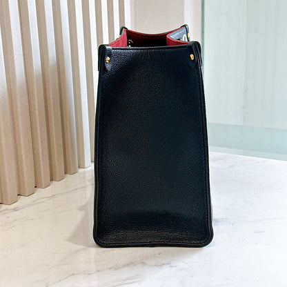 LV On The Go MM in Black and Creme
