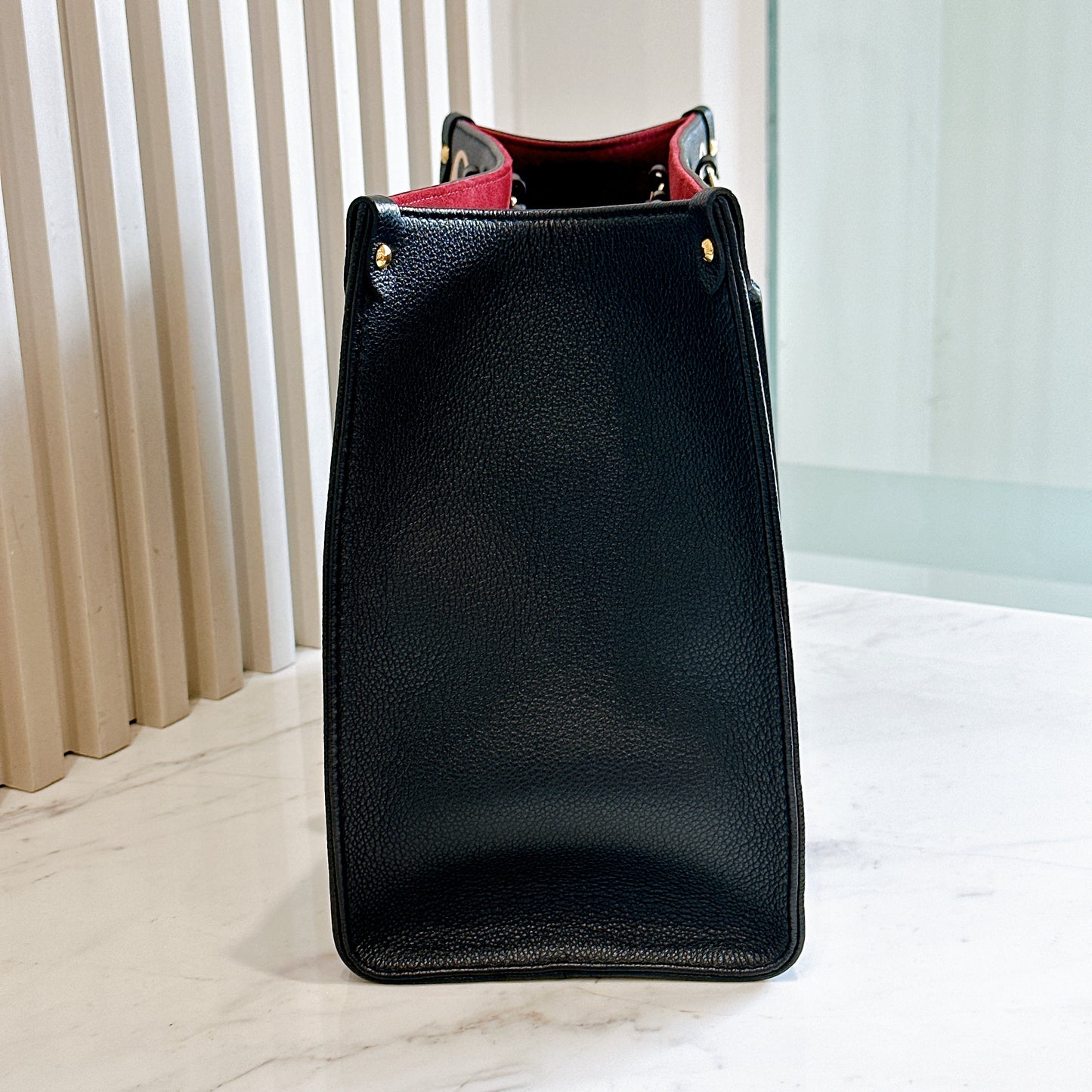 LV On The Go MM in Black and Creme