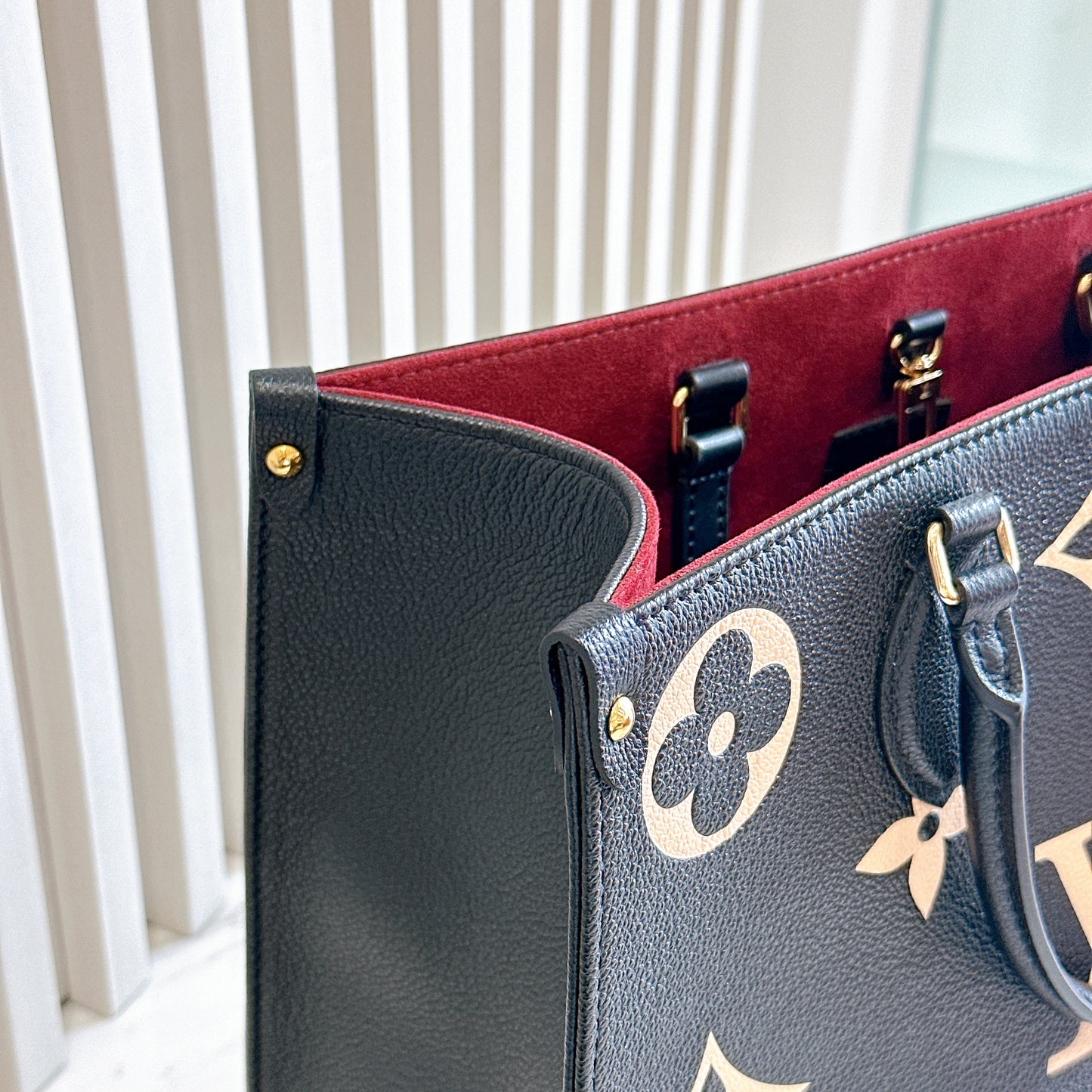 LV On The Go MM in Black and Creme