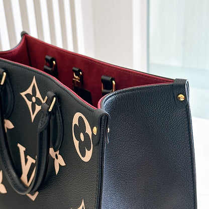 LV On The Go MM in Black and Creme