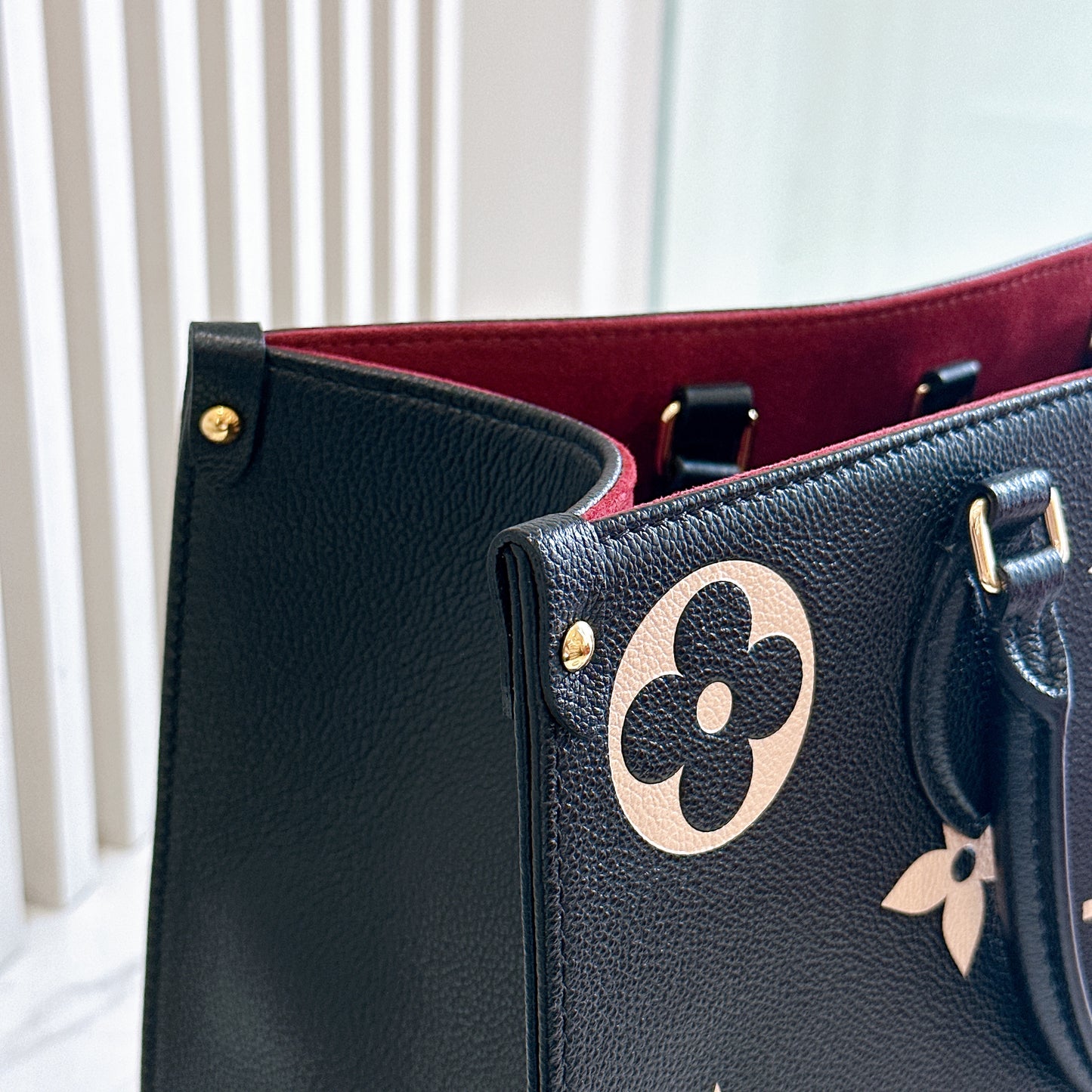 LV On The Go MM in Black and Creme