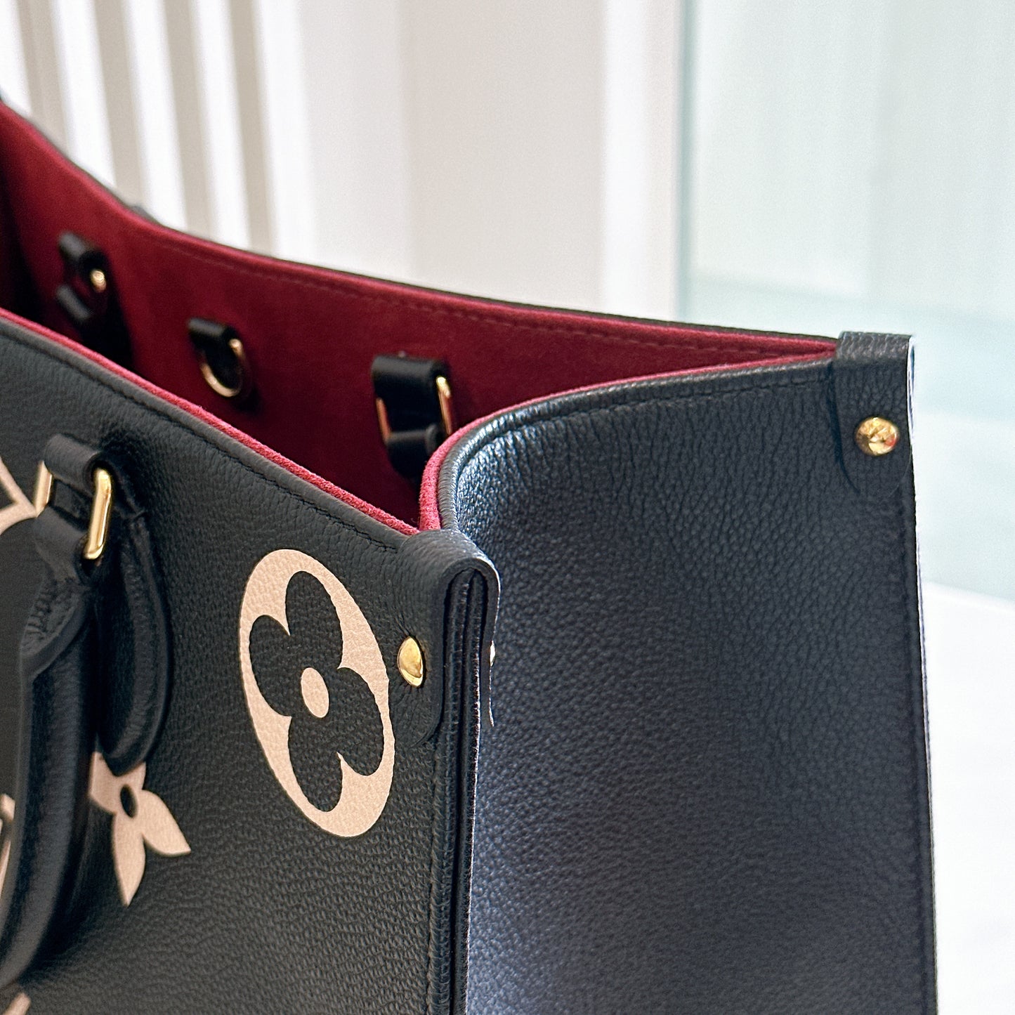 LV On The Go MM in Black and Creme