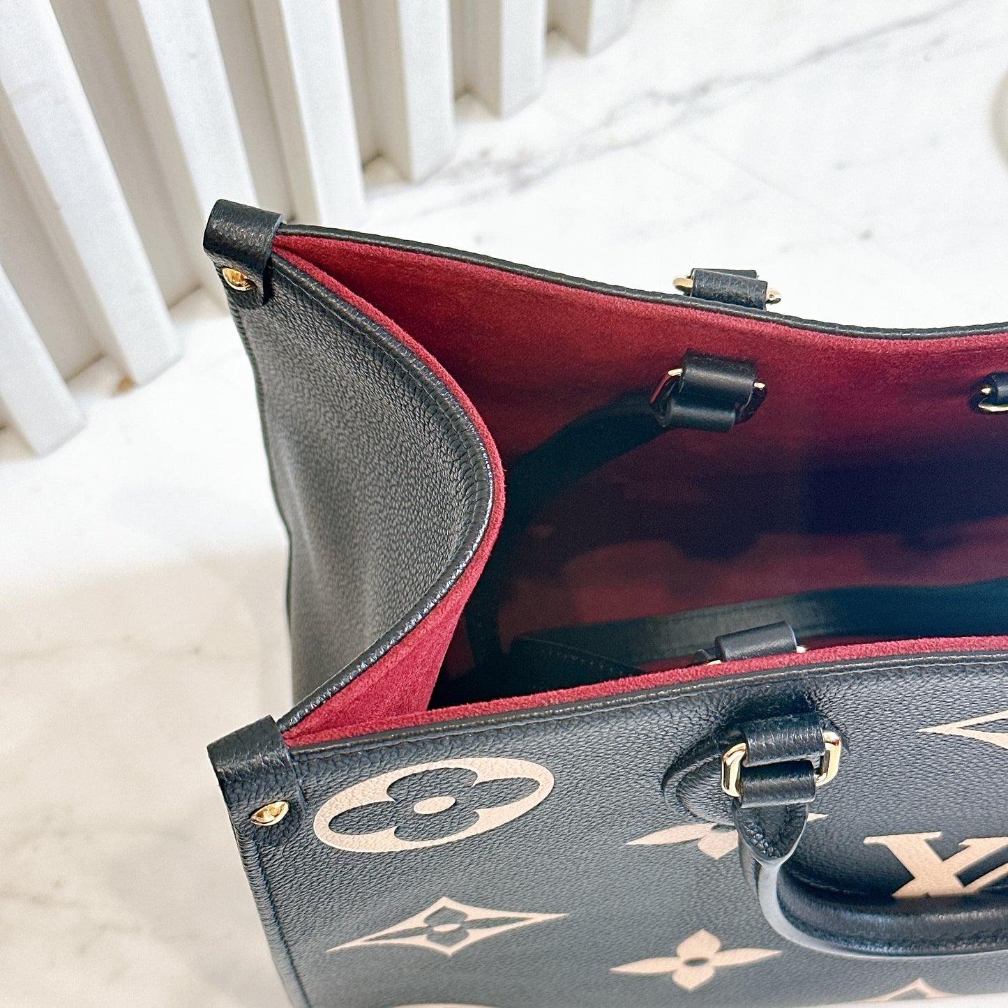 LV On The Go MM in Black and Creme