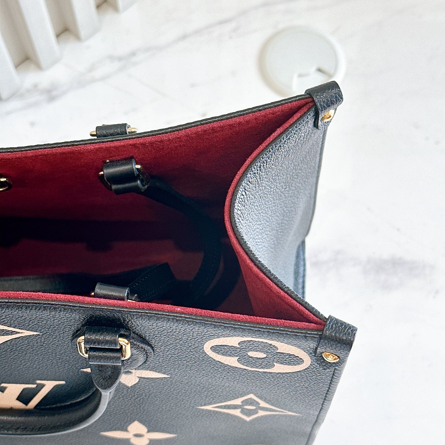 LV On The Go MM in Black and Creme