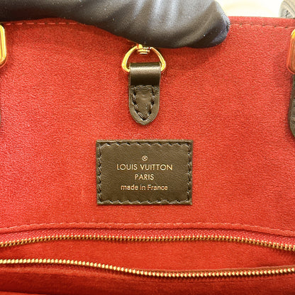 LV On The Go MM in Black and Creme