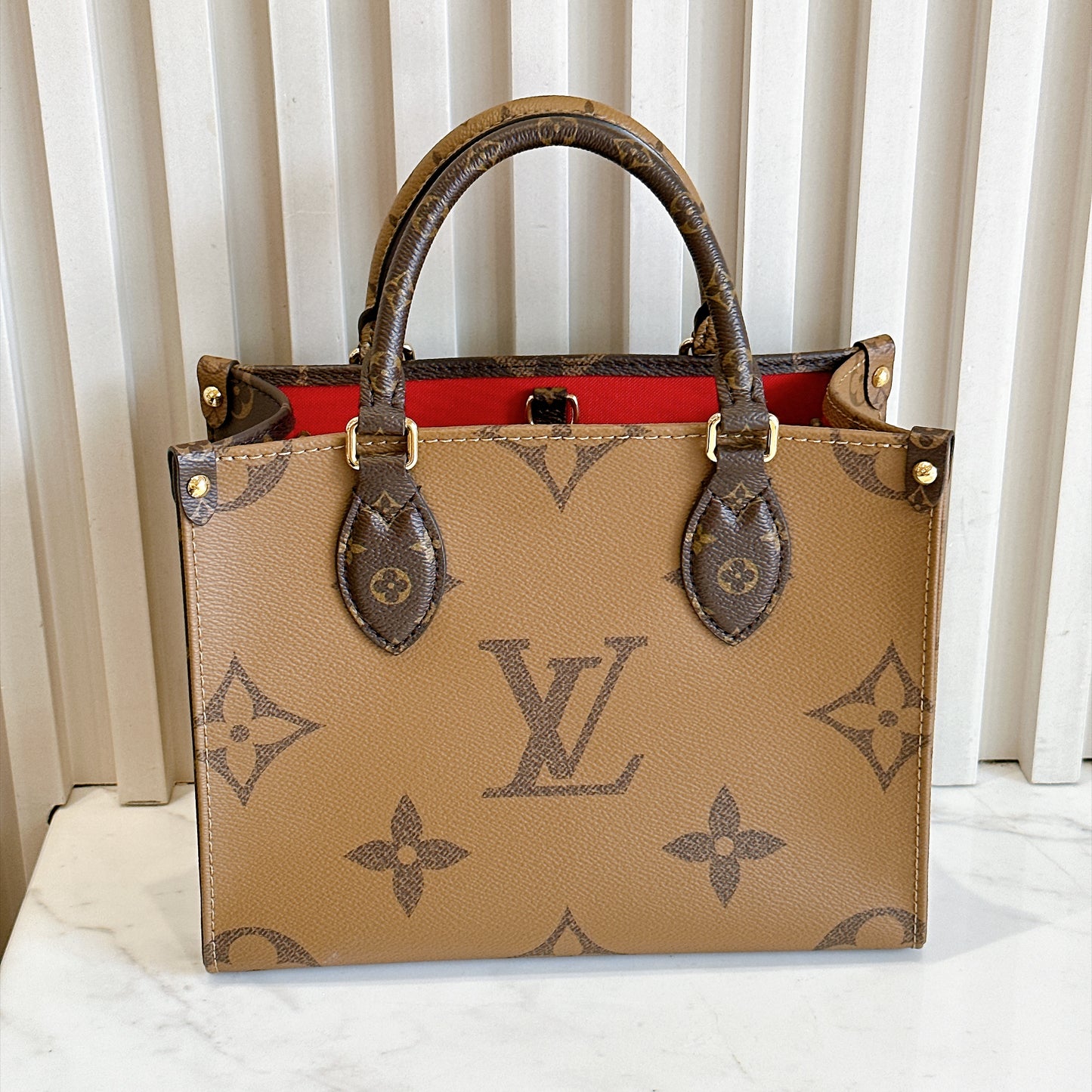 LV On The Go PM in Reverse Monogram