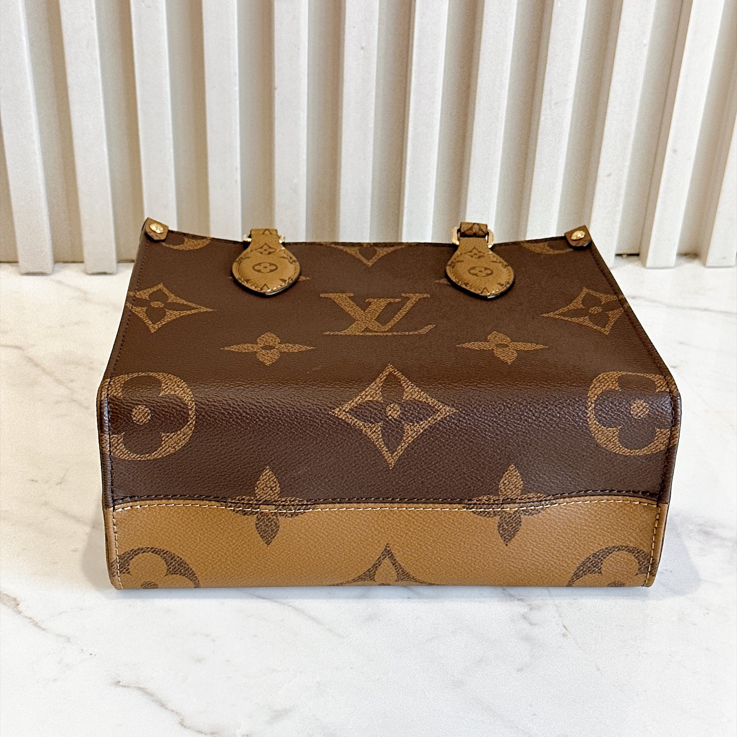 LV On The Go PM in Reverse Monogram