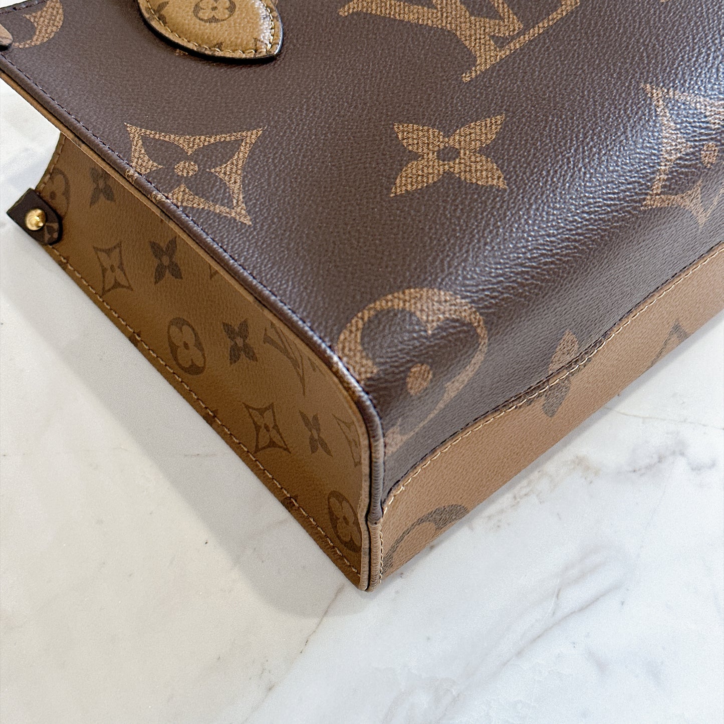 LV On The Go PM in Reverse Monogram
