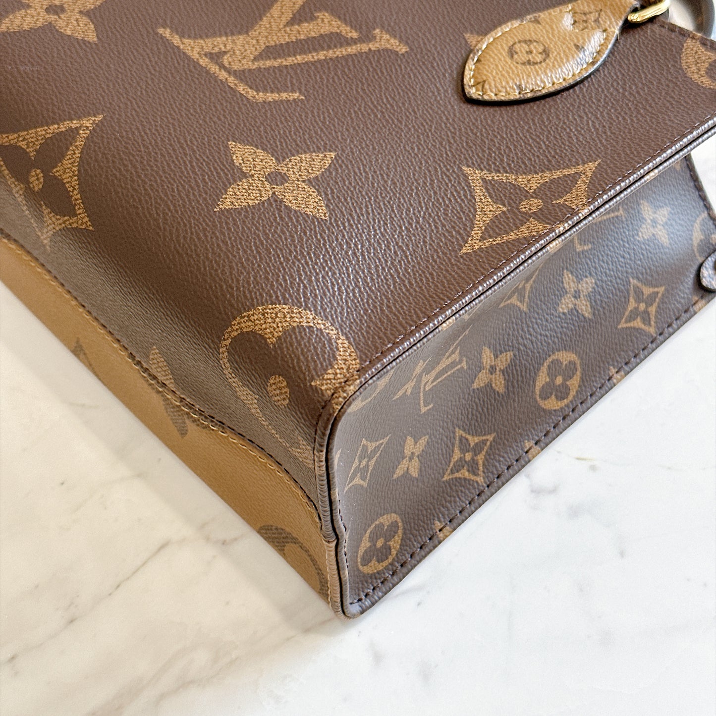 LV On The Go PM in Reverse Monogram