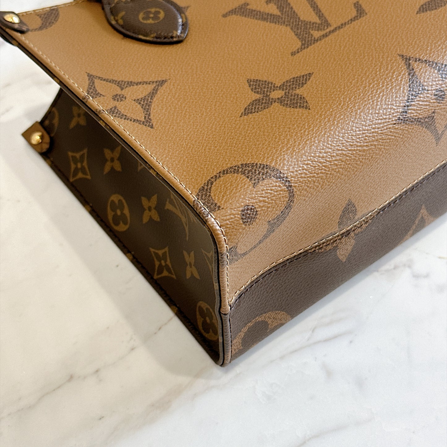 LV On The Go PM in Reverse Monogram
