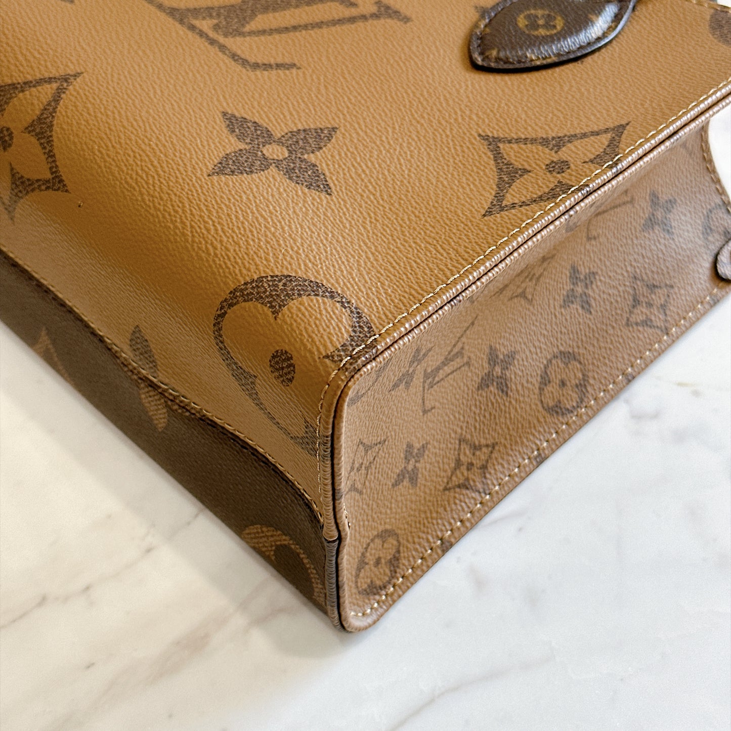 LV On The Go PM in Reverse Monogram