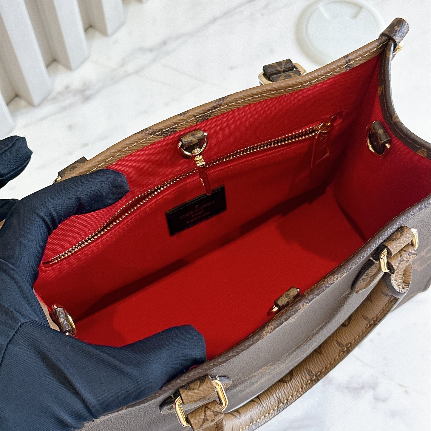 LV On The Go PM in Reverse Monogram