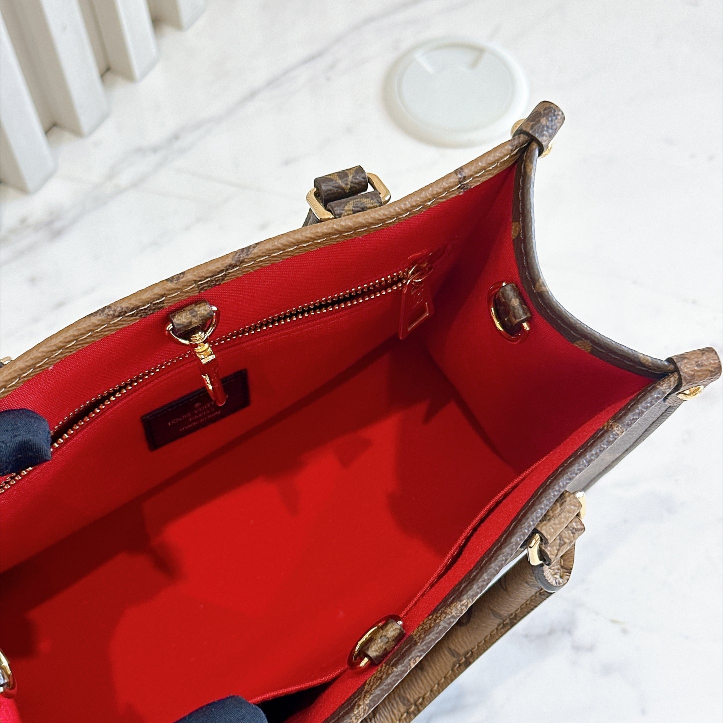 LV On The Go PM in Reverse Monogram