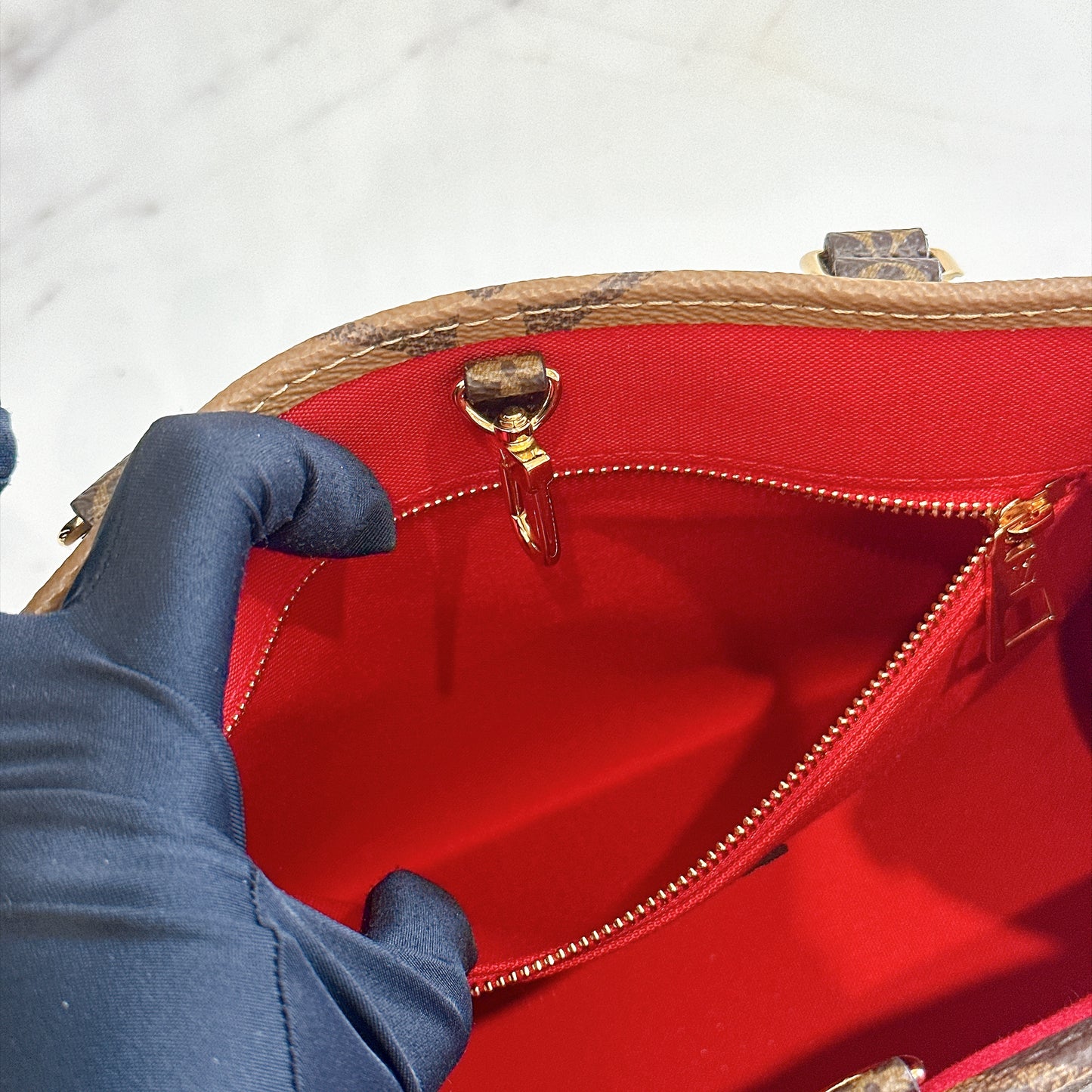 LV On The Go PM in Reverse Monogram