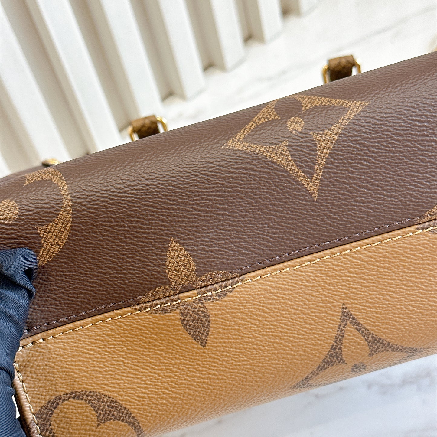 LV On The Go PM in Reverse Monogram