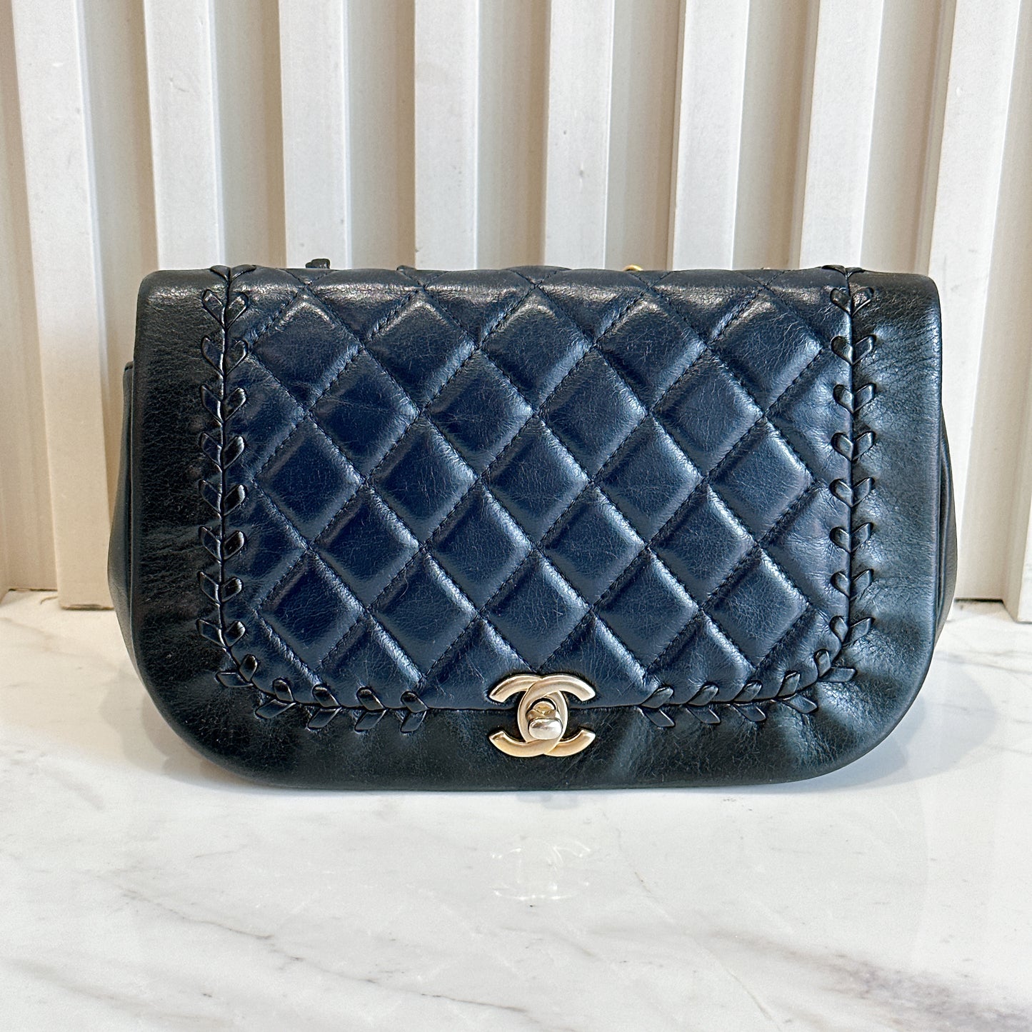 Chanel CC Braided Saddle Flap in Quilted Lambskin