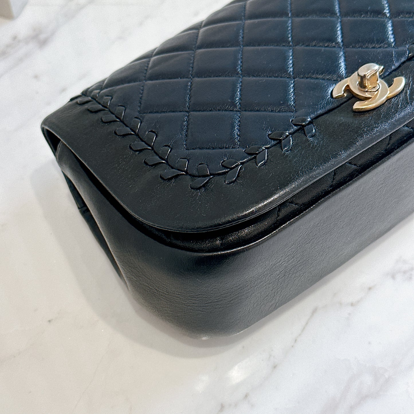 Chanel CC Braided Saddle Flap in Quilted Lambskin