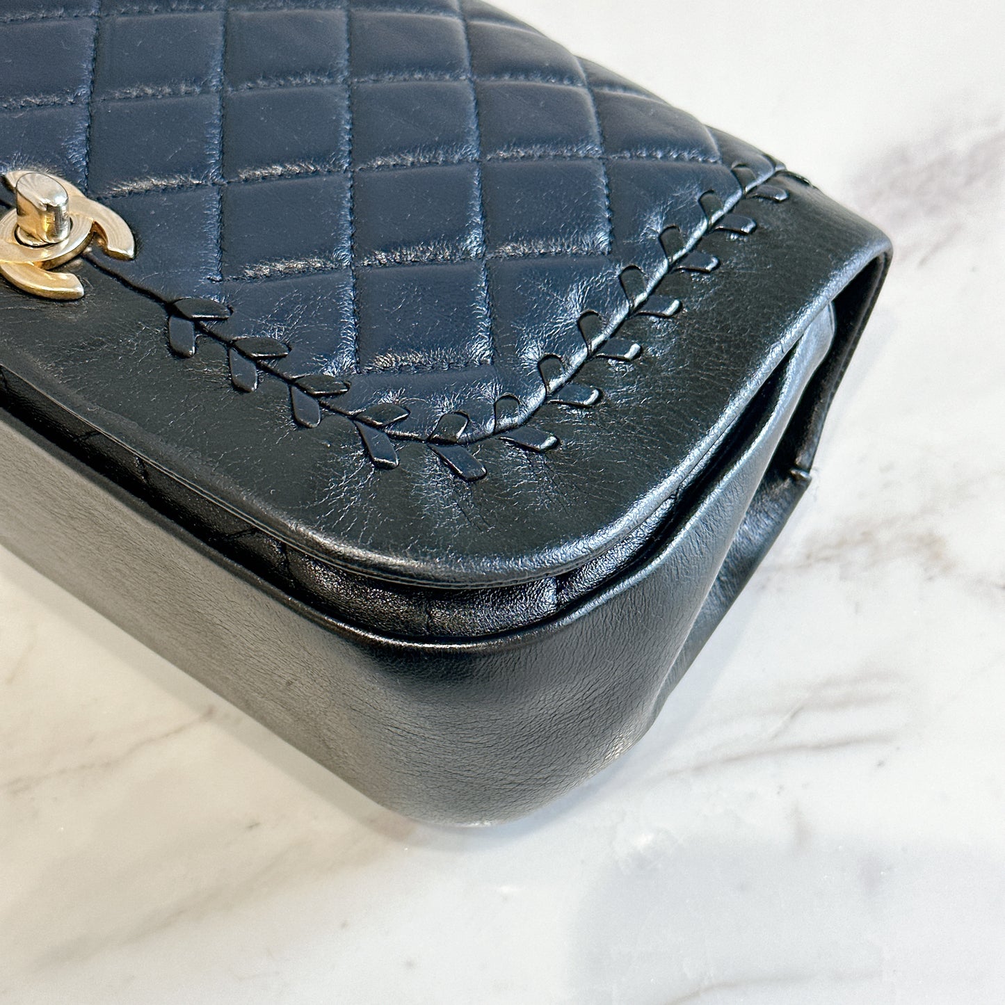 Chanel CC Braided Saddle Flap in Quilted Lambskin