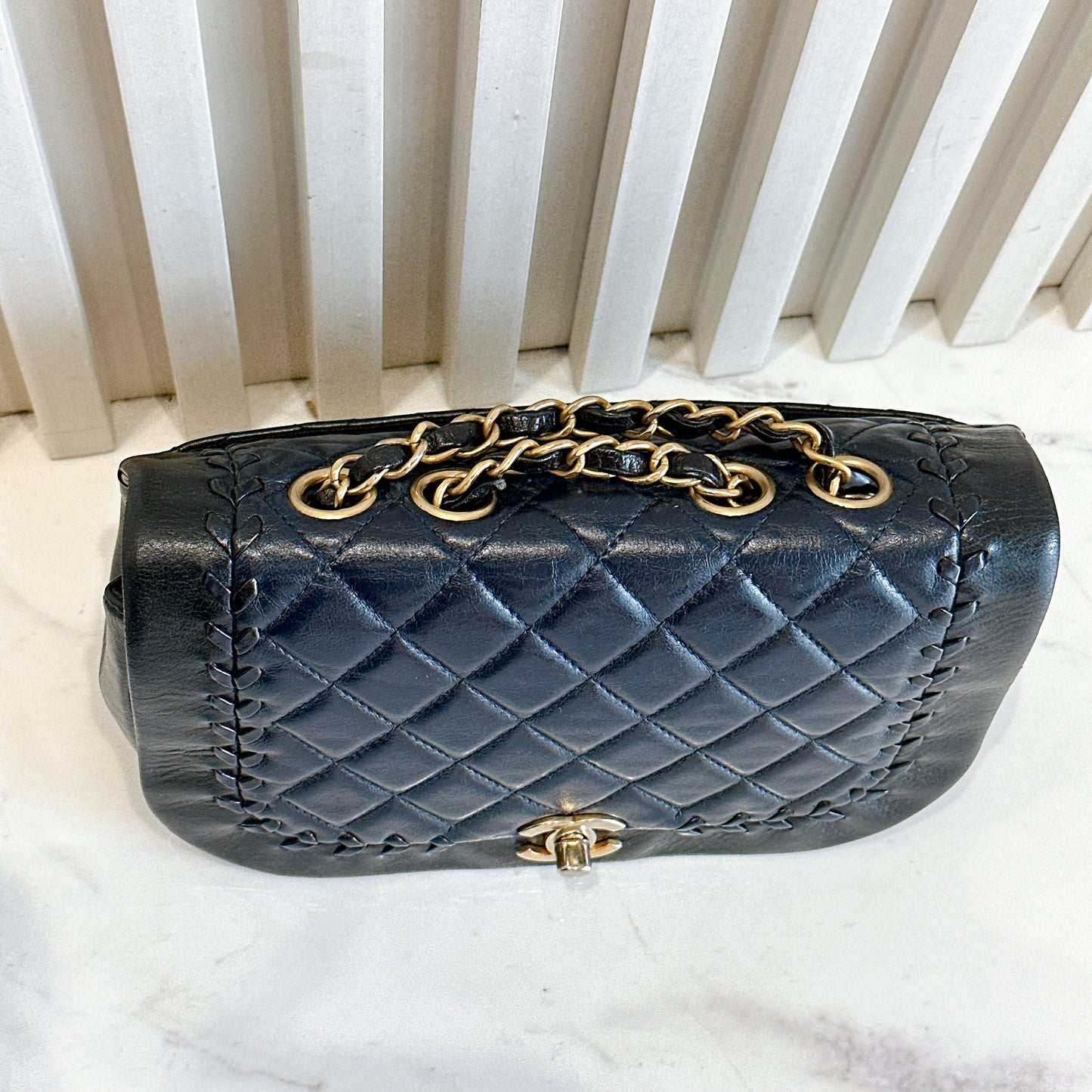 Chanel CC Braided Saddle Flap in Quilted Lambskin