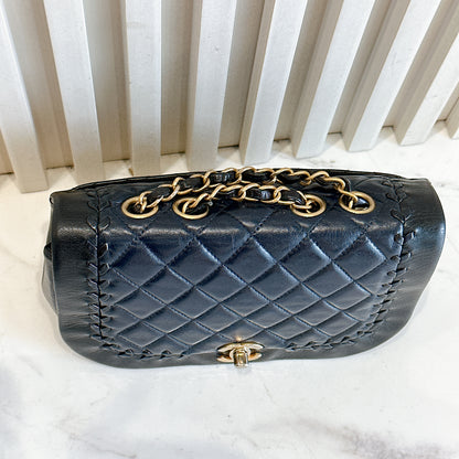 Chanel CC Braided Saddle Flap in Quilted Lambskin