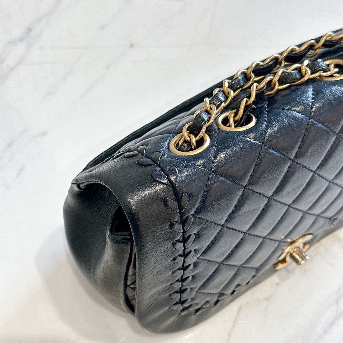 Chanel CC Braided Saddle Flap in Quilted Lambskin