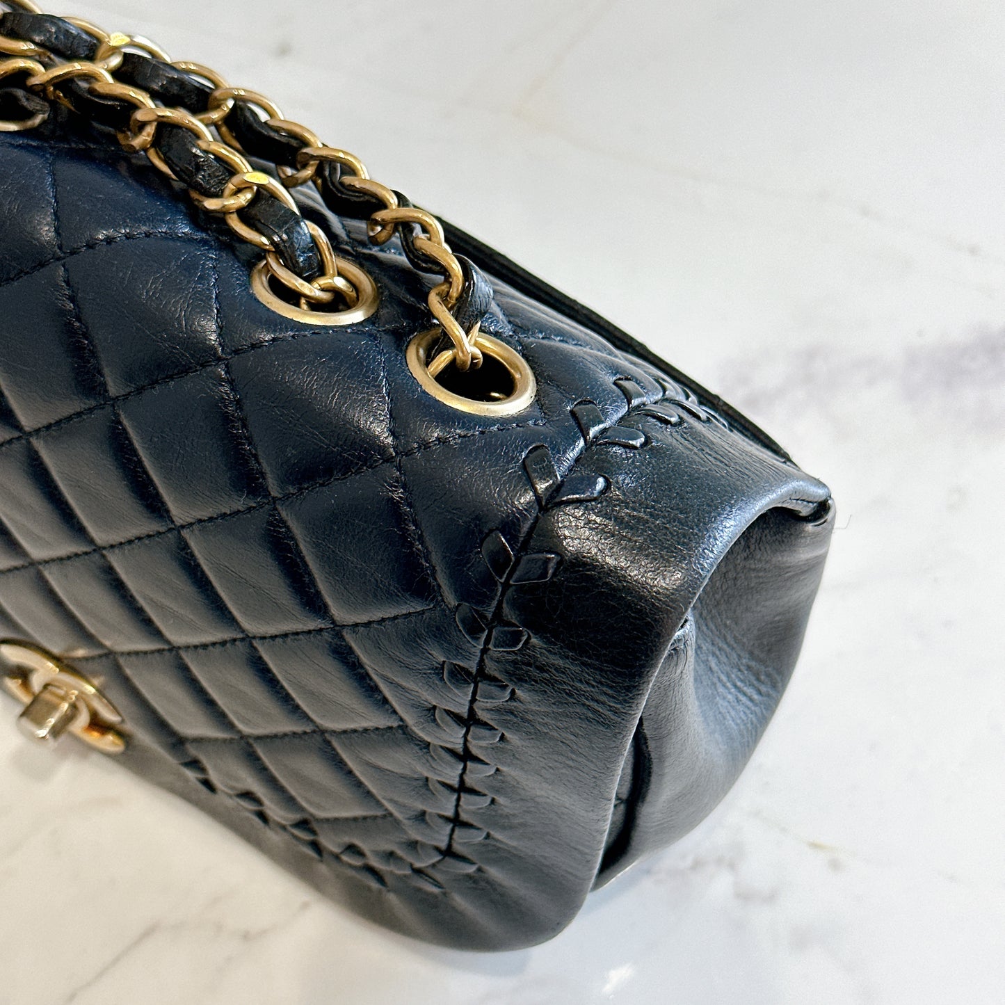 Chanel CC Braided Saddle Flap in Quilted Lambskin